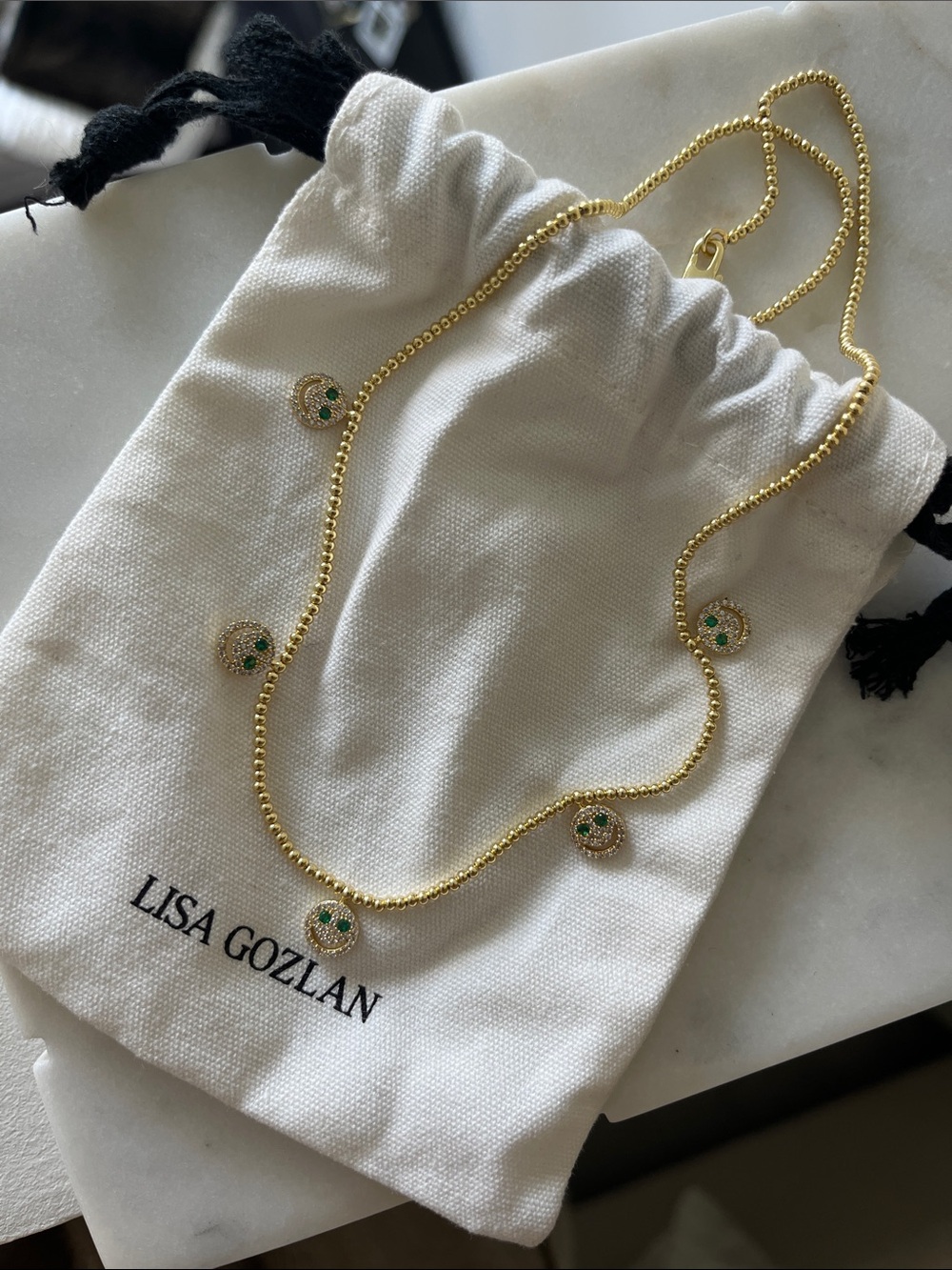 Happy face necklace by Lisa gozlan
